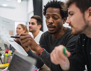 Team discussing project in office environment.