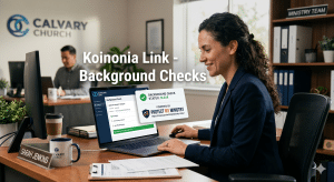 Church staff reviewing background check on laptop